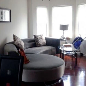 Living Room with Natural Light Coming in From Large Windows